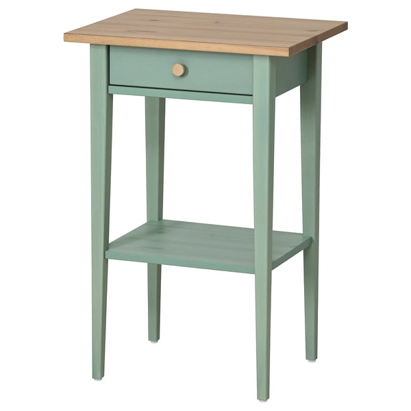 A wooden HEMNES side table in grey-green with a light wood top. It has one drawer and a shelf, offering both storage and display.