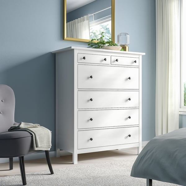 White HEMNES 6-drawer dresser in solid pine, traditional style, tall & slim, fits well next to bed & mirror, with golden & green accents.