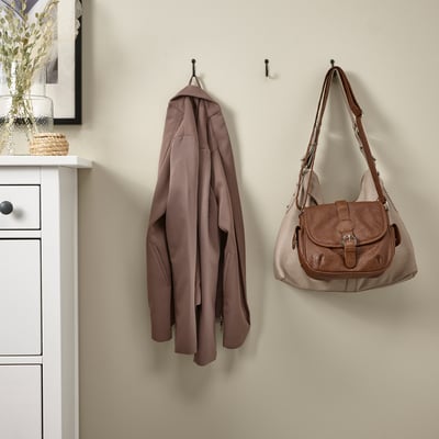 Three wall hooks: coat, bag, one free. Keeps items organised.