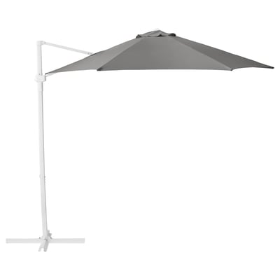 The HÖGÖN parasol is grey, has a rectangular canopy, and stands on a white frame with a stable base.