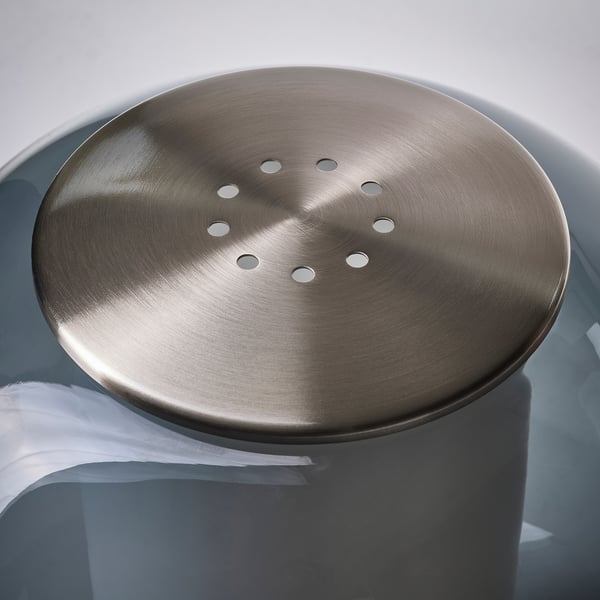 Metal-covered lamp base; smooth, brushed nickel finish; circular design with multiple air holes.