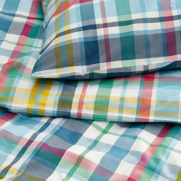 Vibrant plaid fabric, soft texture, smooth cotton-blend. Bright, multicoloured check pattern. High-quality, comfortable material.
