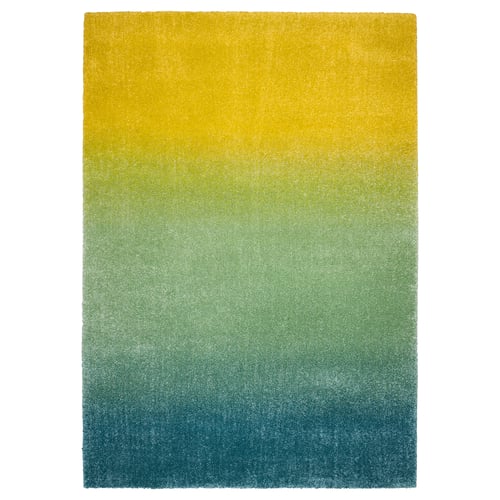 HOTELLRUM rug: vibrant gradient from yellow to blue, plush, rectangular.