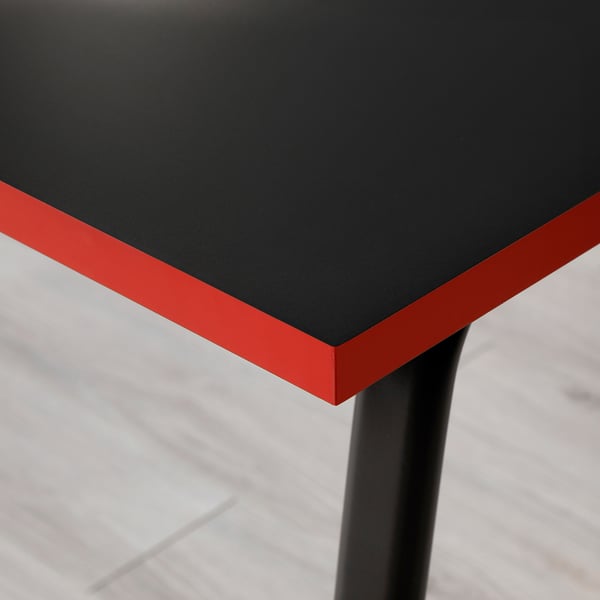 Black and red gaming table with smooth, durable surface and sturdy legs. Designed for stability and low light reflection.