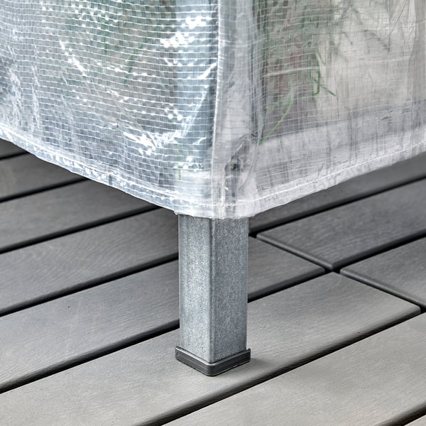 Shelf with clear cover, protective feet, for indoor/outdoor storage.