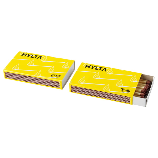 Two yellow boxes labelled HYLTA, one open showing matches inside, made of recycled paperboard.
