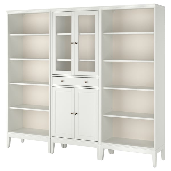 A white IDANÄS furniture set with glass doors and shelves, combining classic design with modern functionality.