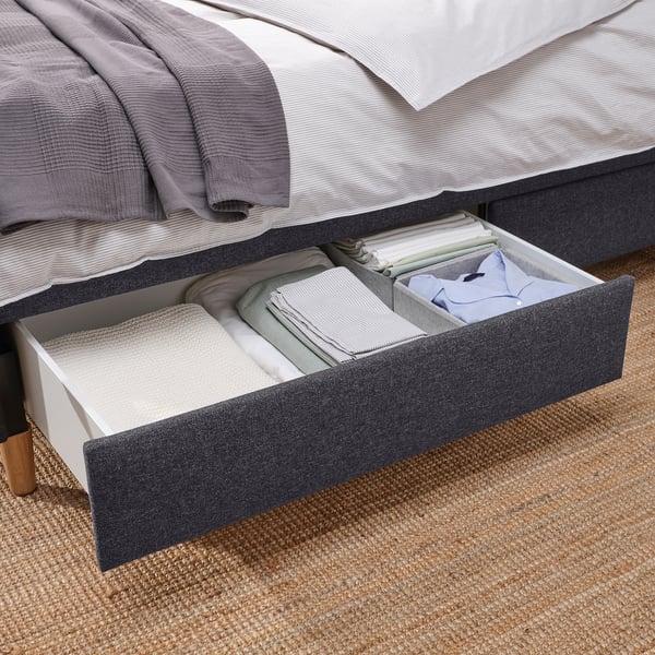Bed with under-drawer storage, soft-close feature. Drawers organised with folded linens. Buttoned headboard, upholstered for comfort.