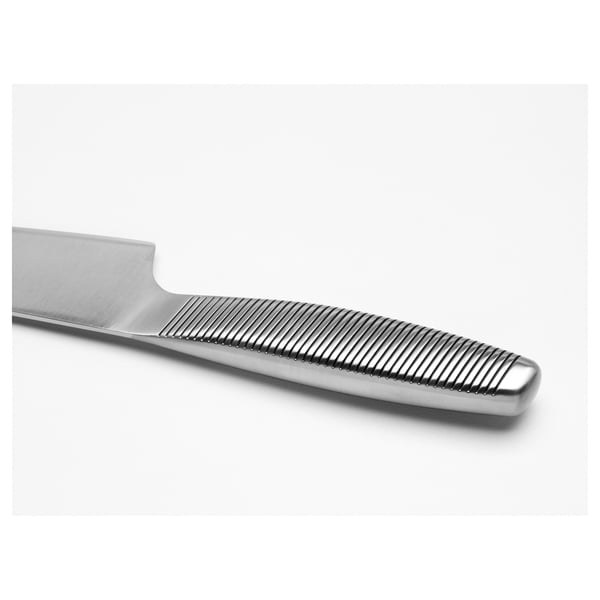 Close-up of stainless steel knife handle with textured grip for secure hold.