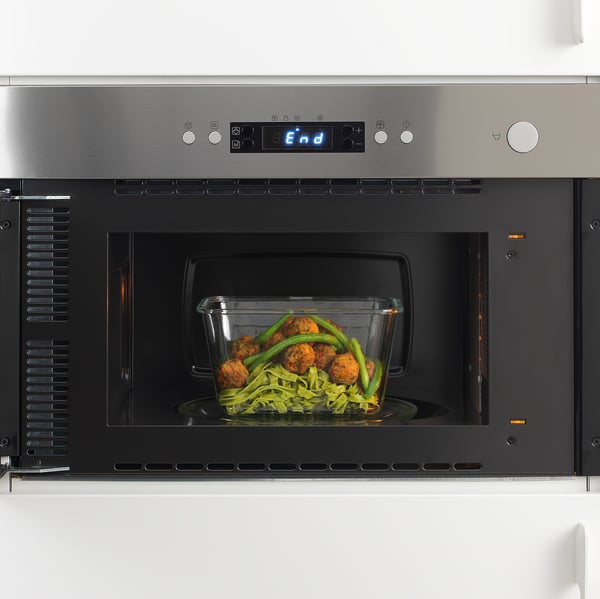 Built-in microwave with digital display and touch controls. Cooking complete, food ready to serve.