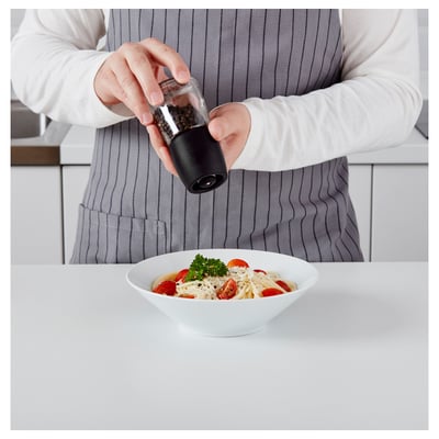 Black ikea spice grinder with glass jar base & ceramic top.