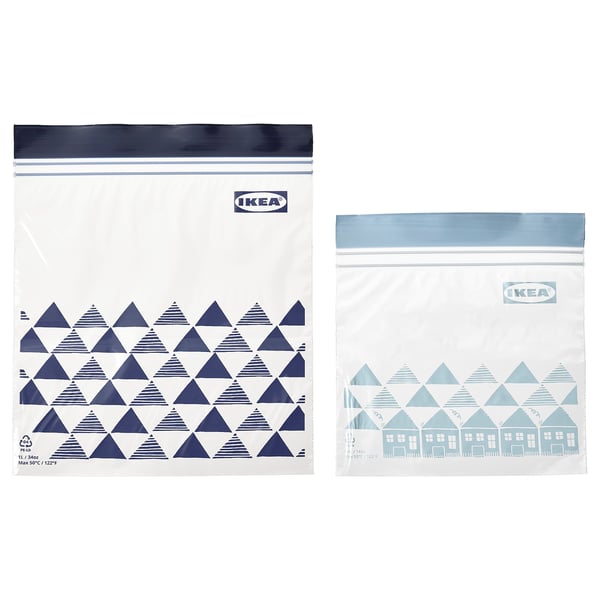 Two ikea ISTAD bags, one clear with blue triangles, one light blue with house design, sealer top, transparent.