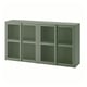 An olive green IVAR metal cabinet with mesh doors, rectangular and modern in design, offering closed storage.
