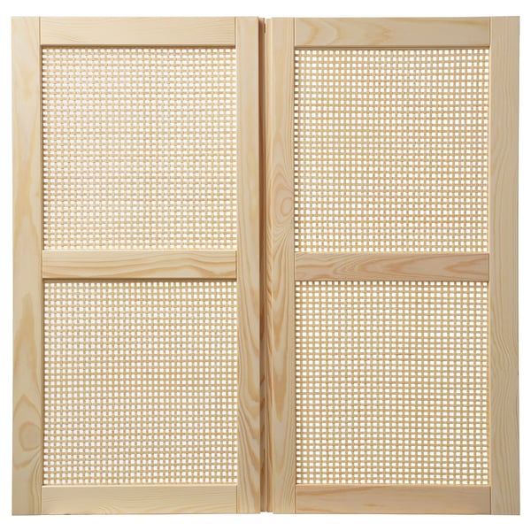 A pair of light wooden IVAR cabinet doors with a woven bamboo centre, framed by solid pine.