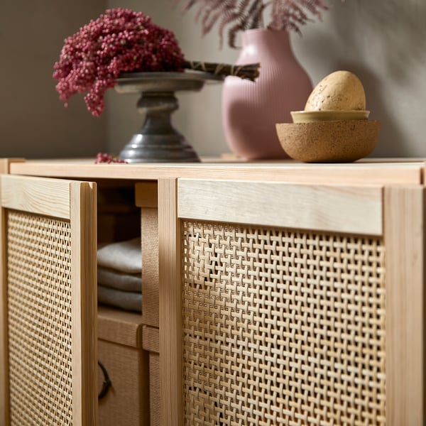 IVAR storage with bamboo doors, vase, bowl, natural wood.