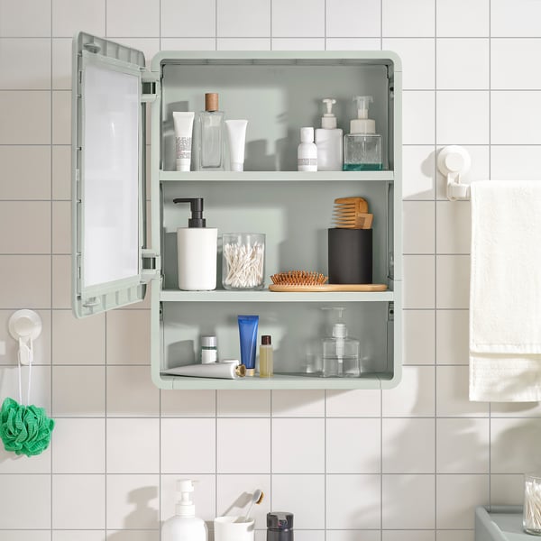 Green bathroom cabinet with mirror, open and closed storage, wall-mounted.