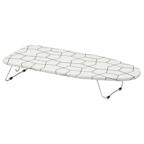 Depicts a JÄLL white ironing board with a mesh surface, supported by adjustable metal legs, designed for compact storage.