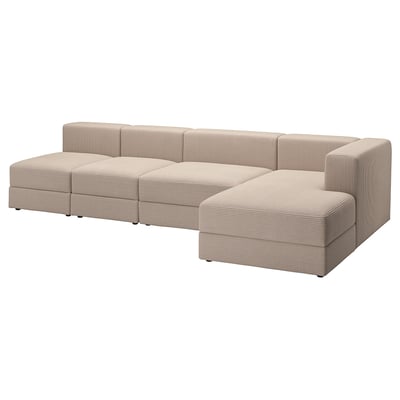 A beige modular sectional sofa named JÄTTEBO. It a storage chaise and square seats, offering comfort and practicality for socializing and relaxation.