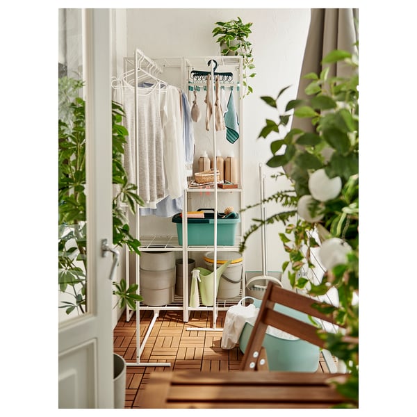 White JOSTEIN storage for humid areas, ideal for balconies or bathrooms, with steel and plastic elements, organising towels and laundry.