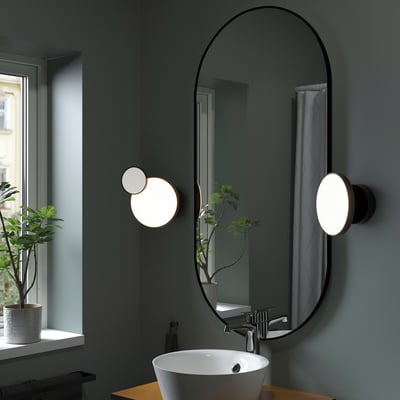 KABOMBA art deco wall lamp. Black, oval mirror, round lights. Adjustable, bathroom-safe. Beside sink, smaller than window.