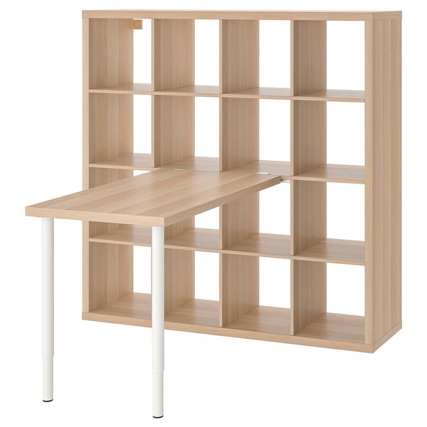 Light wood KALLAX desk unit with shelves, white legs, and angled top.