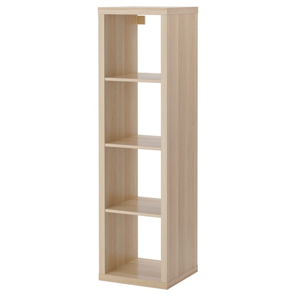 An ikea KALLAX light brown wooden shelf unit with four open compartments.