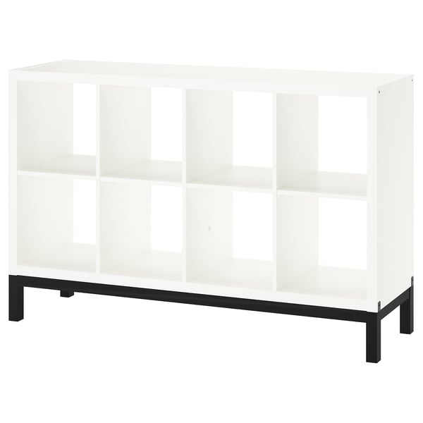 The KALLAX shelf unit, white, rectangular, with black metal legs for a modern look.