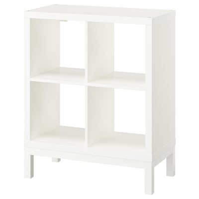 White KALLAX shelf unit in square shape with clean lines and airy design. Made of particleboard and steel.