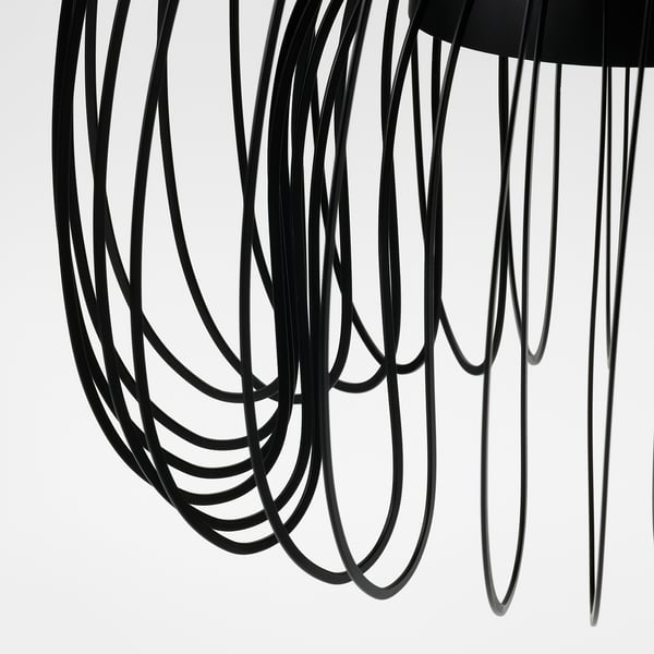 Modern pendant lamp with intricate black wire design, emitting soft, diffused light. Elegant and contemporary, perfect for stylish interiors.