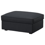 A KIVIK footstool in dark grey with a soft, textured fabric cover and square shape.