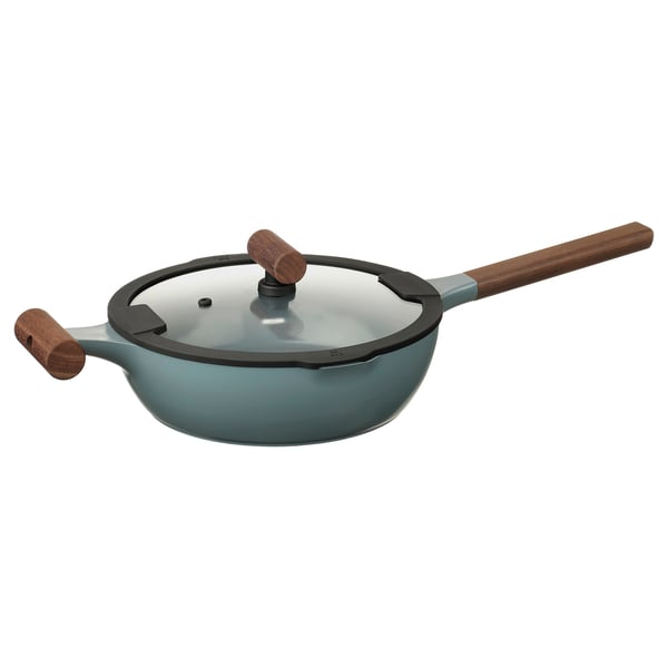 A KLIPPFISK sauté pan in grey-turquoise with wooden handles and a glass lid, designed for cooking and serving.