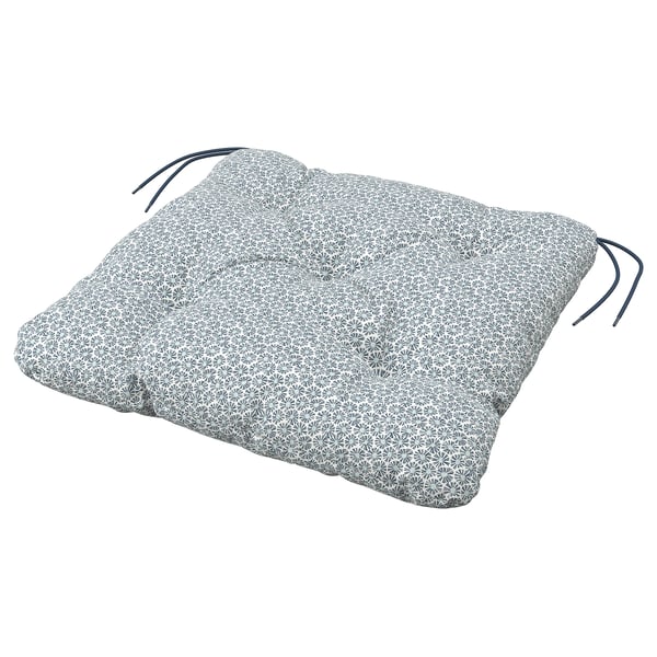 A grey KLÖSAN cushion with a flower pattern, tied edges, and recycled polyester material.