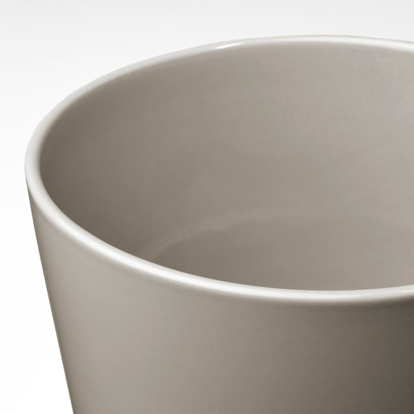 Simple, elegant planter with smooth, glossy finish. Rounded shape, visible drain hole, and clean design. Suitable for indoor or outdoor use.