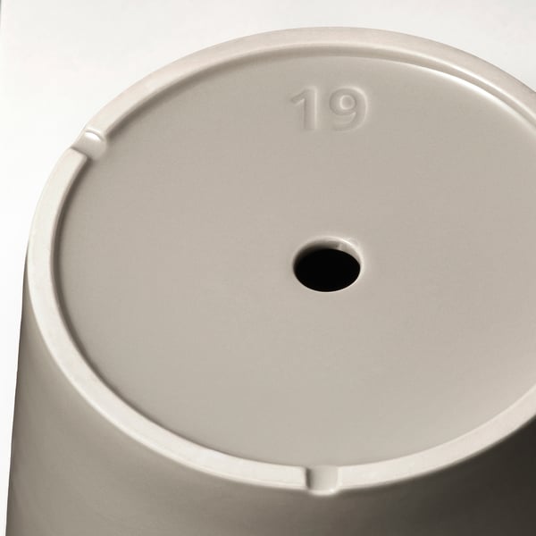 Close-up of sleek, gold-colored, cylindrical planter with 19 embossed, designed for durability and aesthetic appeal.