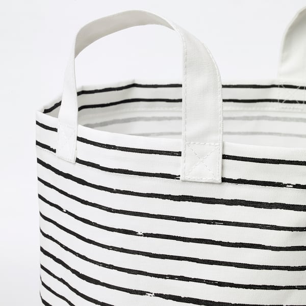 Foldable laundry bag with black stripes and white handles, showing sturdy and practical design.