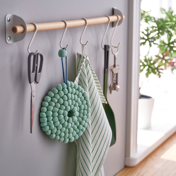 Kitchen hooks with scissors, pom-pom holder, striped apron.
