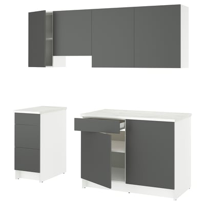 Modern grey and white kitchen cabinets with countertop. Wall and base units; doors and drawers.
