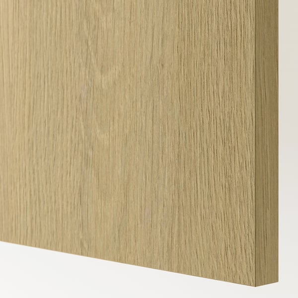 A close-up of a high-quality wood-textured surface from a KNOXHULT kitchen cabinet, displaying a smooth, natural oak finish.
