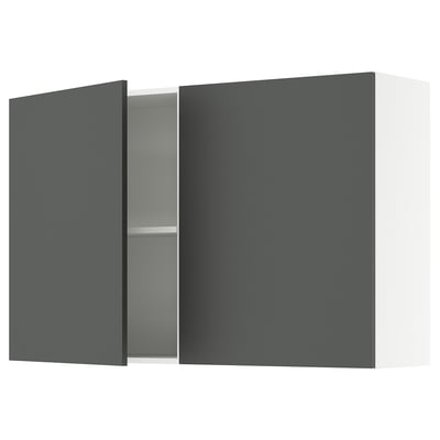Wall-mounted cabinet, single door open, reveals adjustable shelf.
