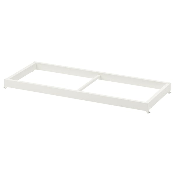 A white KOMPLEMENT clothes rail made of epoxy powder-coated steel and fibreboard, designed for shallow wardrobe frames.