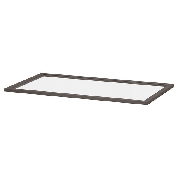 A rectangular glass shelf, framed in dark grey, designed for storage and display.