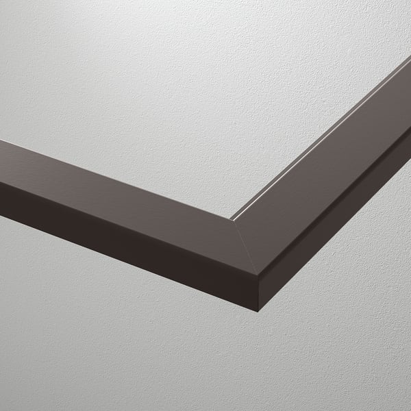 A close-up of a modern glass shelf with sleek metal edge framing.