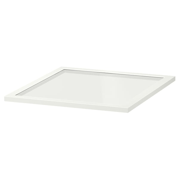 A white KOMPLEMENT glass shelf by IKEA. Its rectangular, with a flat, transparent glass surface framed in white.