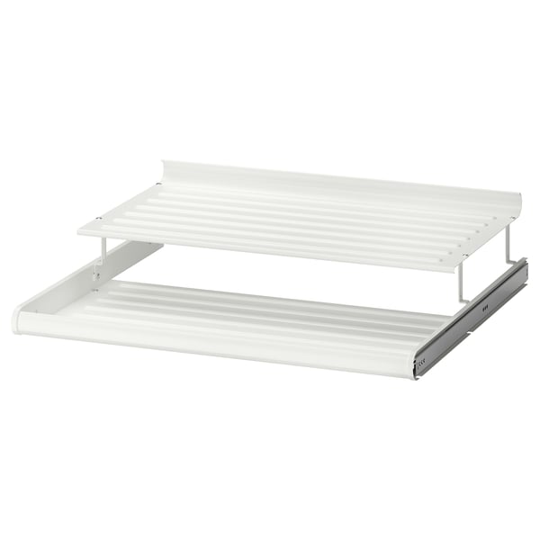 A white KOMPLEMENT metal shoe shelf with alternating levels to maximize storage space.