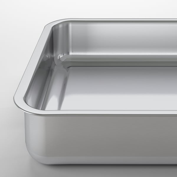 Silver stainless steel roasting pan; sturdy, smooth edges; ideal for baking or grilling.
