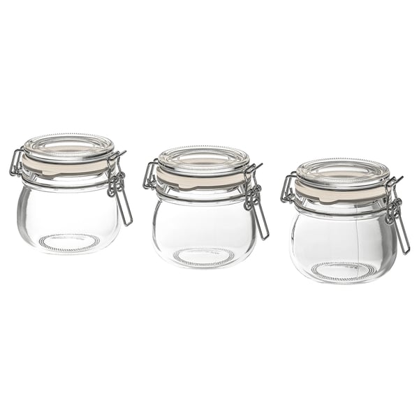Three clear glass KORKEN jars with metal clamps and rubber seals, arranged in a row.
