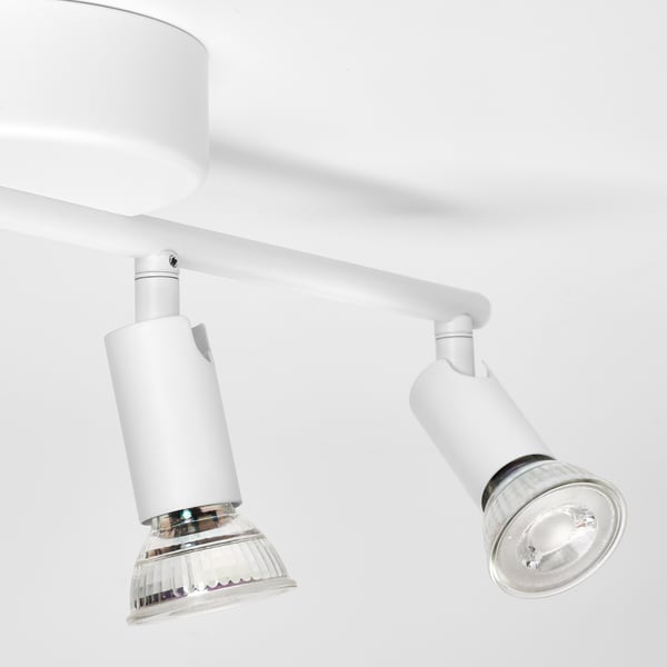 Modern ceiling track lighting with 4 adjustable spotlights, perfect for directing light precisely. Sleek, white design, ideal for various rooms.