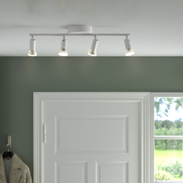 Modern ceiling track light with 4 adjustable spotlights, ideal for hallways or kitchen islands, mounted on a white ceiling.