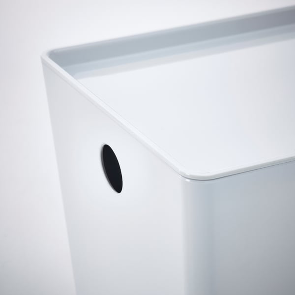 White plastic storage box corner with black cutout handle, clean and modern design.