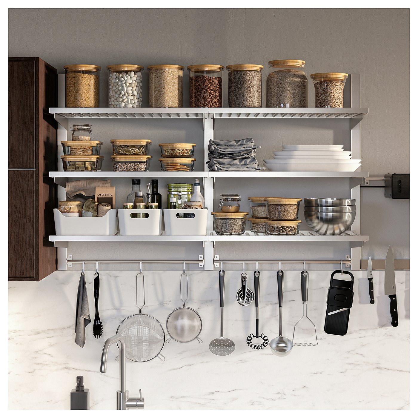 Modern kitchen with KUNGSFORS stainless-steel storage. Shelves hold jars and containers, while hooks below hang utensils.